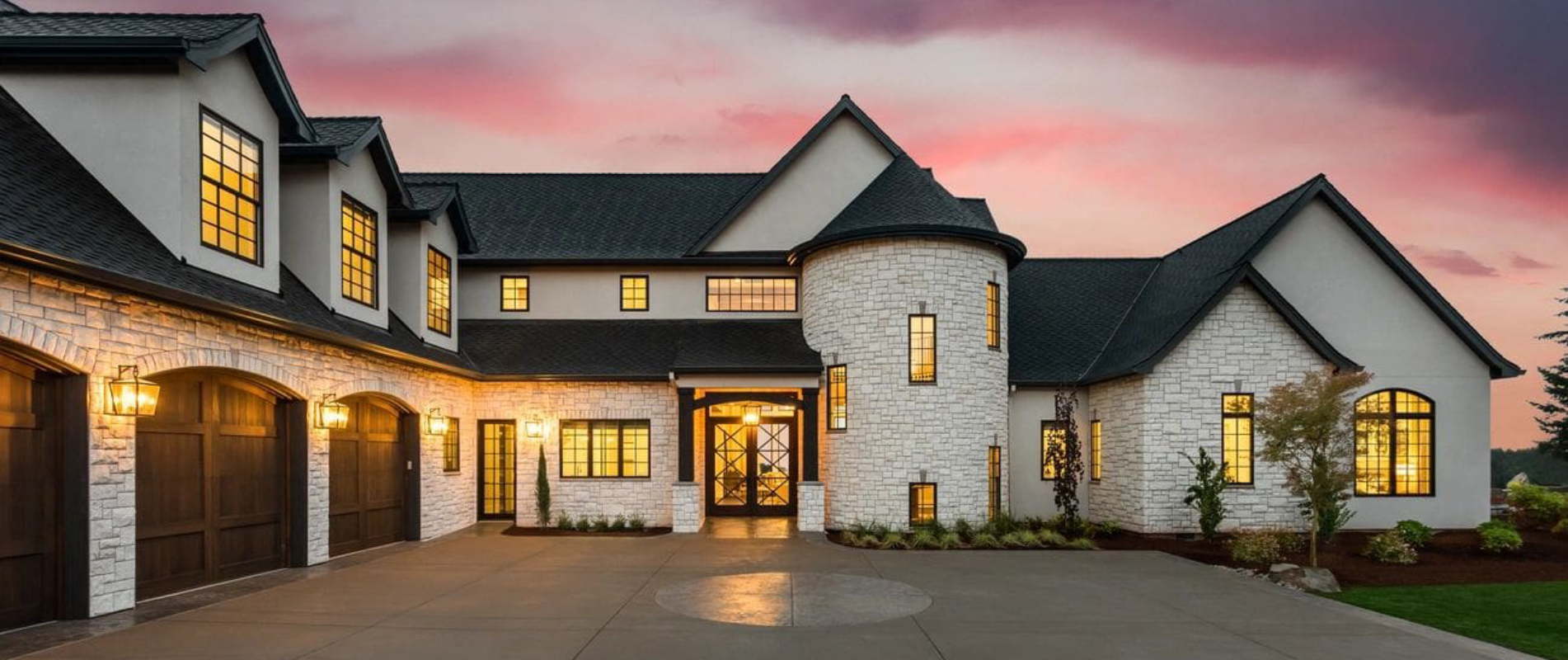 A large white house with a circular driveway.