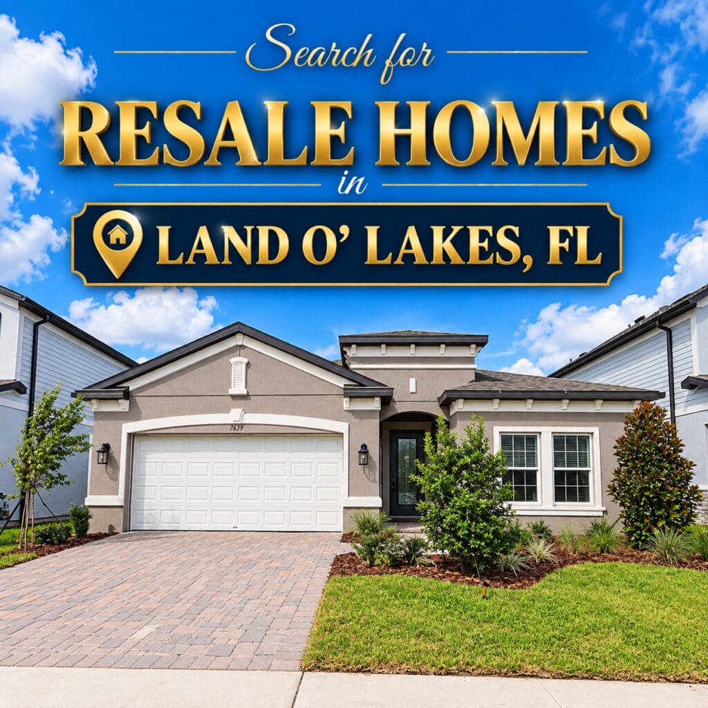 Search for resale homes in Land O' Lakes, FL. A single-story stucco home with a two-car garage, paver driveway, and landscaped front yard in a Pasco County neighborhood by elena esquen relocation specialist